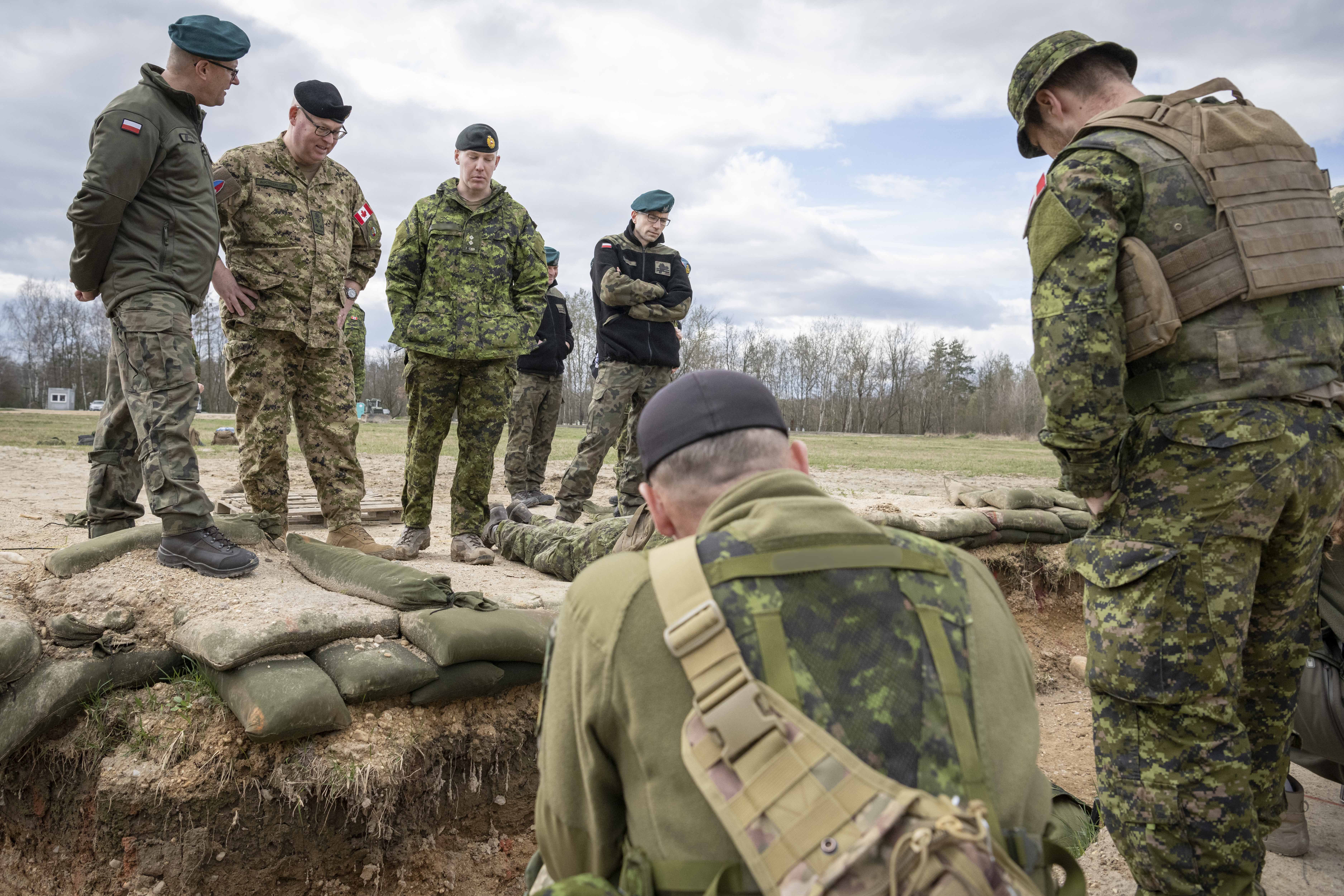 : VAdm Auchterlonie tours the Engineer Training Element training area where CAF soldiers instruct Ukrainian  and Polish Armed Forces soldiers in south-western Poland during Op UNIFIER on March 25, 2023 Credit: Corporal Marco Tijam